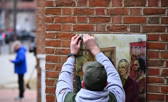 Panels that were part of an exhibit on slavery at the President's House Site in Philadelphia are put back Thursday, Feb. 19, 2026. (AP Photo/Joe Lamberti)