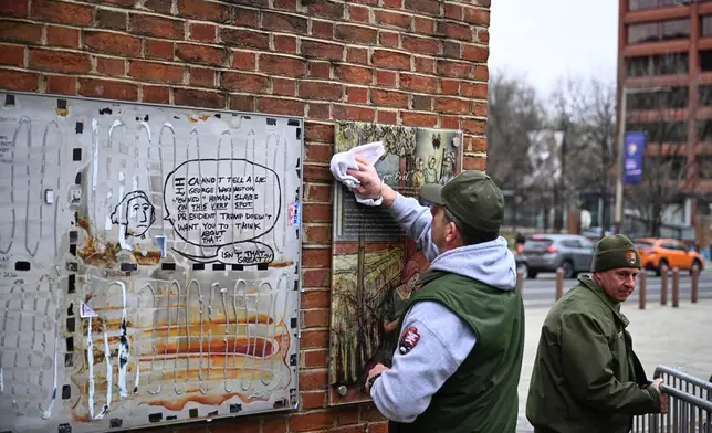 Panels that were part of an exhibit on slavery at the President's House Site in Philadelphia are put back Thursday, Feb. 19, 2026. (AP Photo/Joe Lamberti)