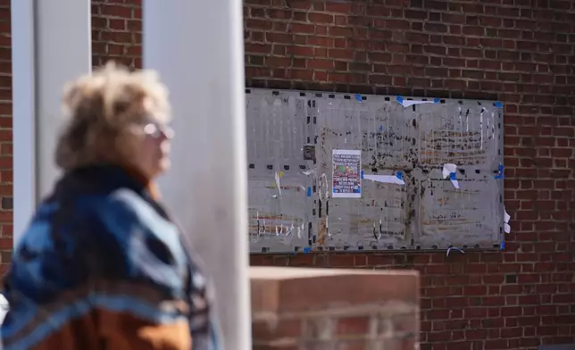 U.S. District Judge Cynthia Rufe inspects the location of the now removed explanatory panels that were part of an exhibit on slavery at President's House Site in Philadelphia, Monday, Feb. 2, 2026. (AP Photo/Matt Rourke)