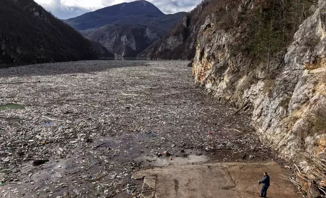 An aerial view shows tons of waste clogging the Drina river in Visegrad, Bosnia, Thursday, Feb. 5, 2026. (AP Photo/Armin Durgut)