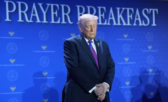 President Donald Trump bows his head during the National Prayer Breakfast, Thursday, Feb. 5, 2026, in Washington. (AP Photo/Evan Vucci)