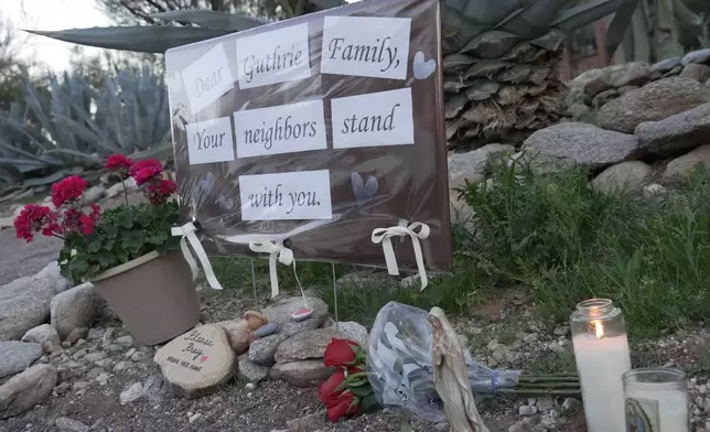 A small vigil grows near Nancy Guthrie‘s house, Monday, Feb. 9, 2026 in Tucson, Ariz. (AP Photo/Ty ONeil)