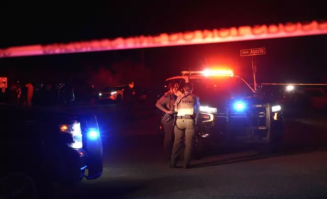 Sheriff's officials block the entrance to a road where a home was being searched in Rio Rico, Arizona, on Tuesday, Feb. 10, 2026, in connection to the investigation of Nancy Guthrie's disappearance. (AP Photo/Ty ONeil)