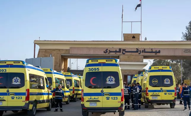 Ambulances line up to enter the Egyptian gate of the Rafah crossing on the way to the Gaza Strip, in Rafah, Egypt, Sunday, Feb. 1, 2026. (AP Photo/Mohamed Arafat)