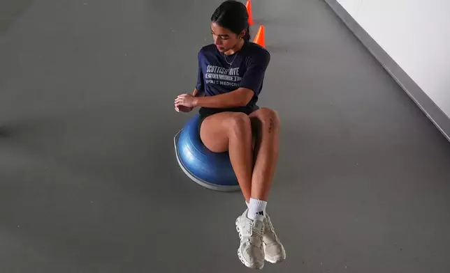 Plano East High School soccer player Sofia Tepichian works to strengthen her knees at the Movement Science Laboratory at Scottish Rite for Children in Frisco, Texas, Jan. 22, 2026. (AP Photo/LM Otero)