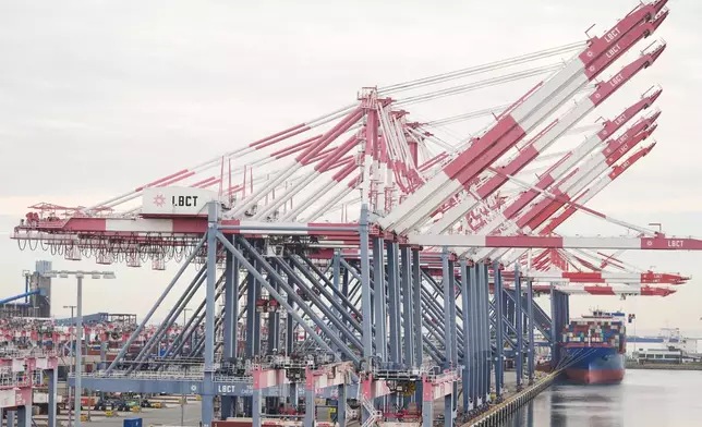 A container ship is docked at the Port of Long Beach Friday, Feb. 20, 2026, in Long Beach, Calif. (AP Photo/Damian Dovarganes)