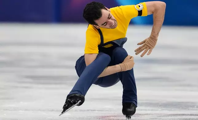Tomas Guarino Sabate of Spain competes during the men's figure skating short program at the 2026 Winter Olympics, in Milan, Italy, Tuesday, Feb. 10, 2026. (AP Photo/Ashley Landis)