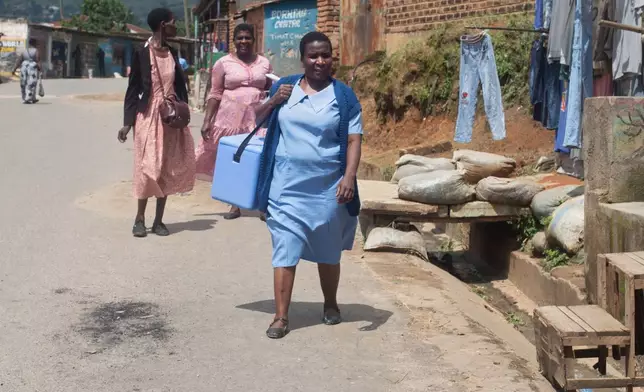 Health workers get ready to administer oral polio vaccines to children in the Ndirande Township of Blantyre, Malawi, Wednesday, Feb. 11, 2026. (AP Photo/Kenneth Jali)