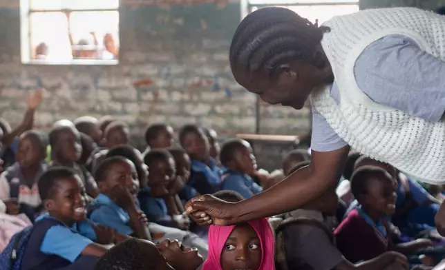 A healthcare worker administers polio vaccine to a child in the Ndirande Township of Blantyre, Malawi, Wednesday, Feb. 11, 2026. (AP Photo/Kenneth Jali)