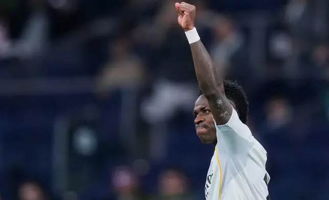 Real Madrid's Vinicius Junior celebrates scoring his side's 4th goal from the penalty spot during the Spanish La Liga soccer match between Real Madrid and Real Sociedad in Madrid, Spain, Saturday, Feb. 14, 2026. (AP Photo/Manu Fernandez)