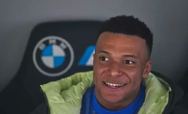 Real Madrid's Kylian Mbappe sits on the bench prior to the Spanish La Liga soccer match between Real Madrid and Real Sociedad in Madrid, Spain, Saturday, Feb. 14, 2026. (AP Photo/Manu Fernandez)