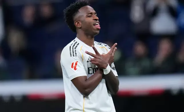 Real Madrid's Vinicius Junior celebrates scoring his side's 4th goal from the penalty spot during the Spanish La Liga soccer match between Real Madrid and Real Sociedad in Madrid, Spain, Saturday, Feb. 14, 2026. (AP Photo/Manu Fernandez)