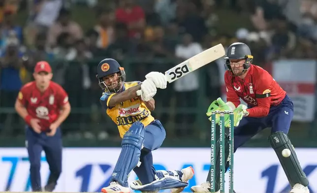 Sri Lanka's Pathum Nissanka, center, plays a shot during the third T20 cricket match between England and Sri Lanka in Pallekele, Sri Lanka, Tuesday, Feb, 3. 2026. (AP Photo/Eranga Jayawardena)