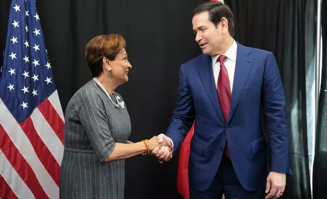 U.S. Secretary of State Marco Rubio, right, meets with Trinidad and Tobago Prime Minister Kamla Persad-Bissessar during the Caribbean Community (CARICOM) meeting in Basseterre, Saint Kitts and Nevis, Wednesday, Feb. 25, 2026. (Jonathan Ernst/Pool photo via AP)
