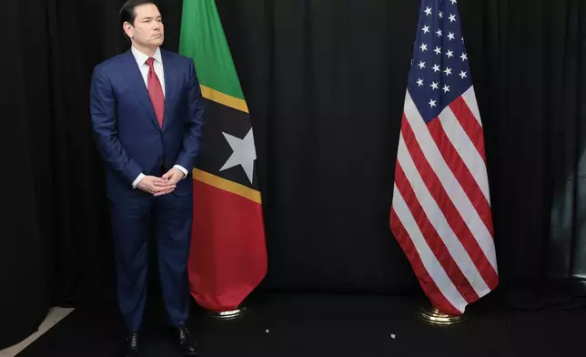U.S. Secretary of State Marco Rubio waits to meet with St. Kitts and Nevis Prime Minister Terrance Drew in Basseterre, Saint Kitts and Nevis, which is hosting the Caribbean Community (CARICOM) meeting, Wednesday, Feb. 25, 2026. (Jonathan Ernst/Pool photo via AP)