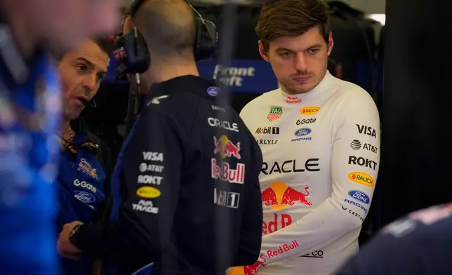 Red Bull driver Max Verstappen of the Netherlands looks on as mechanics prepare his car during the third day of Formula One pre-season test at the Bahrain International Circuit in Sakhir, Bahrain, Friday, Feb. 13, 2026. (AP Photo/Altaf Qadri)