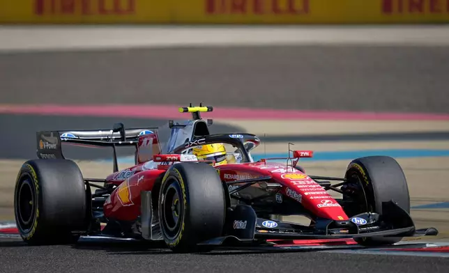 Ferrari driver Lewis Hamilton of Britain steers his car on the third day of Formula One pre-season test at the Bahrain International Circuit in Sakhir, Bahrain, Friday, Feb. 13, 2026. (AP Photo/Altaf Qadri)