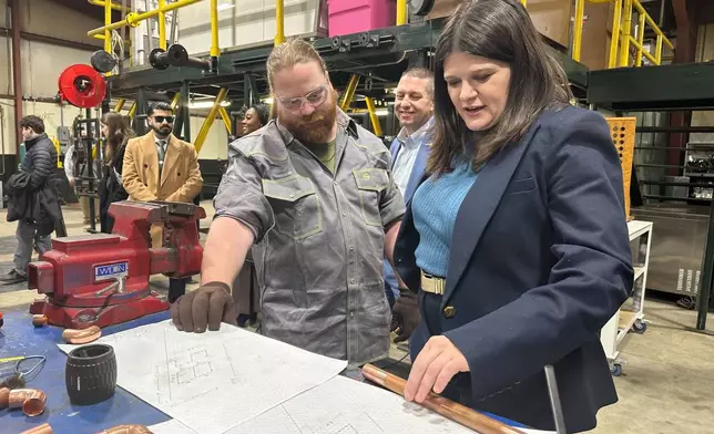 U.S. Rep. Haley Stevens, a Democrat running for U.S. Senate in Michigan, tours a plumbing and pipefitting apprenticeship program workshop at UA Local 85 in Saginaw, Mich., Friday, Jan. 30, 2026. (AP Photo/Isabella Volmert)