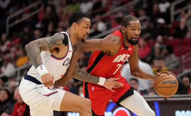 Houston Rockets forward Kevin Durant (7) controls the ball against Los Angeles Clippers forward John Collins (20) during the first half of an NBA basketball game, Tuesday, Feb. 10, 2026, in Houston. (AP Photo/ Karen Warren)