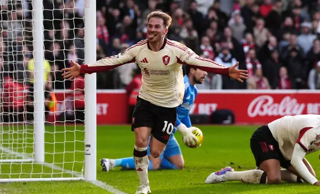 Liverpool's Alexis Mac Allister celebrates scoring during the English Premier League soccer match between Nottingham Forest and Liverpool in Nottingham, England, Sunday Feb. 22, 2026. (Nick Potts/PA via AP)