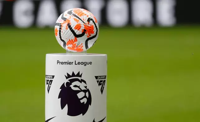 FILE - The match ball is set on a pedestal with the logo of the English Premier League before the soccer match between Newcastle and Aston Villa, in Newcastle, England, on Aug. 12, 2023. (AP Photo/Steve Luciano, File)
