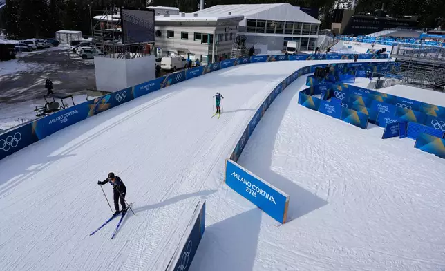 Athletes participate in a biathlon training session at the 2026 Winter Olympics in Anterselva, Italy, Friday, Feb. 6, 2026. (AP Photo/Mosa'ab Elshamy)