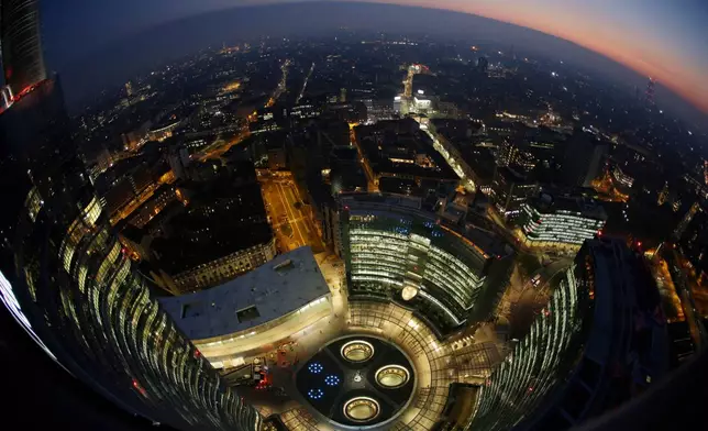 FILE - This photo shows Milan's City Life district at dusk on Jan. 7, 2015. (AP Photo/Luca Bruno, File)