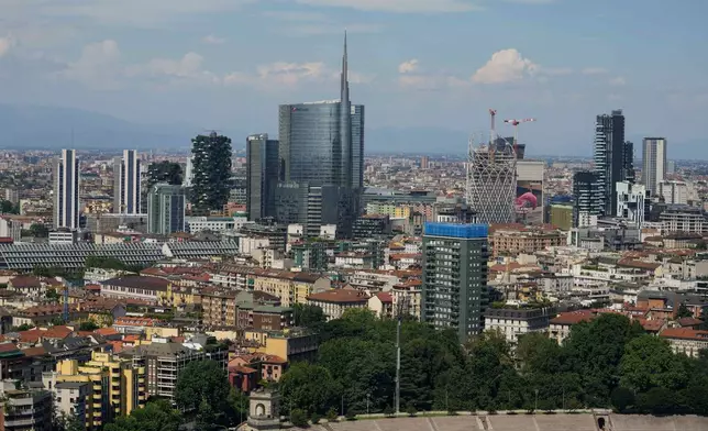 FILE — This photo shows Milan's CityLife district, including the city's tallest buildings, towering over housing architecture on June 26, 2021. (AP Photo/Luca Bruno, File)