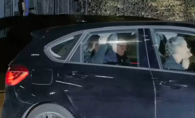 In this photo taken from video by Sky News, Britain's former ambassador to the U.S. Peter Mandelson is seen in a vehicle leaving a police station in London in the early hours of Tuesday, Feb. 24, 2026. (Sky News Exclusive via AP)