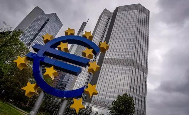 FILE - The Euro sculpture stands in front of the former headquarters of the European Central Bank (ECB) in Frankfurt, Germany, Tuesday, May 23, 2023. (AP Photo/Michael Probst, File)