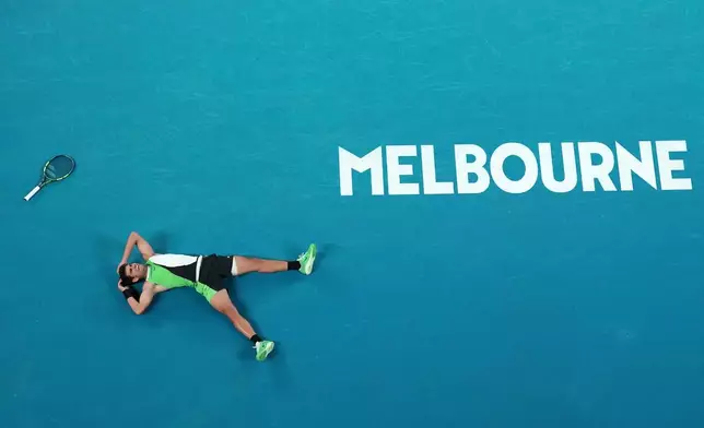 Carlos Alcaraz of Spain reacts after winning the men's singles final match against Novak Djokovic of Serbia at the Australian Open tennis championship in Melbourne, Australia, Sunday, Feb. 1, 2026. (AP Photo/Dar Yasin)