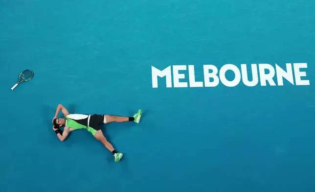 Carlos Alcaraz of Spain reacts after winning the men's singles final match against Novak Djokovic of Serbia at the Australian Open tennis championship in Melbourne, Australia, Sunday, Feb. 1, 2026. (AP Photo/Dar Yasin)