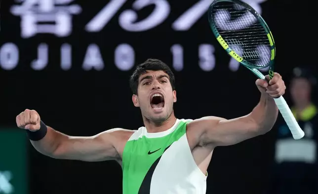 Carlos Alcaraz of Spain reacts during his men's singles final match against Novak Djokovic of Serbia at the Australian Open tennis championship in Melbourne, Australia, Sunday, Feb. 1, 2026. (AP Photo/Aaron Favila)