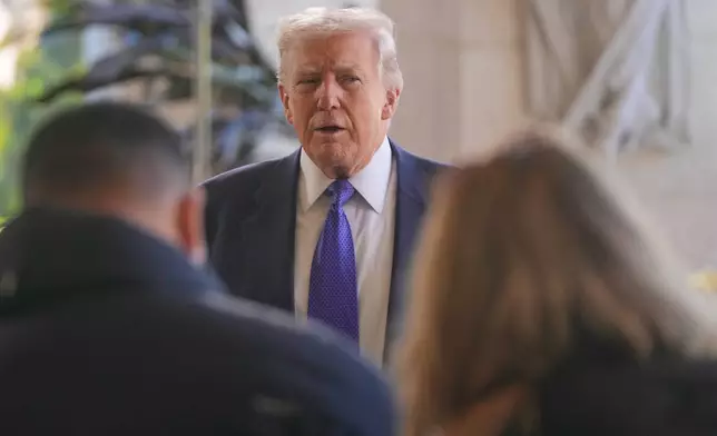 President Donald Trump speaks to reporters at his Mar-a-Lago club, Sunday, Feb. 1, 2026, in Palm Beach, Fla., as he arrives to attend the wedding of White House deputy chief of staff Dan Scavino and Erin Elmore, the director of Art in Embassies at the U.S. Department of State. (AP Photo/Mark Schiefelbein)