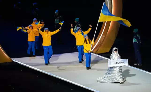 Athletes from Ukraine attend the Olympic opening ceremony at the 2026 Winter Olympics, in Milan, Italy, Friday, Feb. 6, 2026. (AP Photo/Petr David Josek)