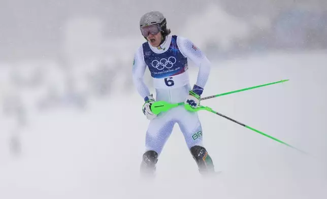 Brazil's Lucas Pinheiro Braathen reacts after crashing during an alpine ski, men's slalom race, at the 2026 Winter Olympics, in Bormio, Italy, Monday, Feb. 16, 2026. (AP Photo/Julia Demaree Nikhinson)
