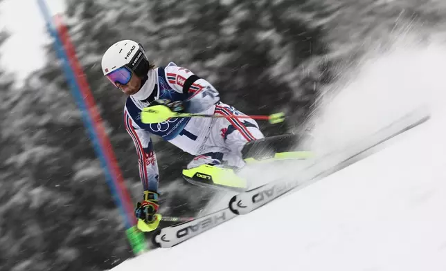 Norway's Atle Lie McGrath speeds down the course, during an alpine ski, men's slalom race, at the 2026 Winter Olympics, in Bormio, Italy, Monday, Feb. 16, 2026. (AP Photo/Gabriele Facciotti)