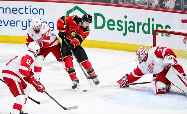 Ottawa Senators' Ridly Greig (71) looks for a shot on goal against Detroit Red Wings' goaltender John Gibson (36) during the third period of an NHL hockey game, in Ottawa, Ontario, Thursday, Feb. 26, 2026. (Spencer Colby/The Canadian Press via AP)