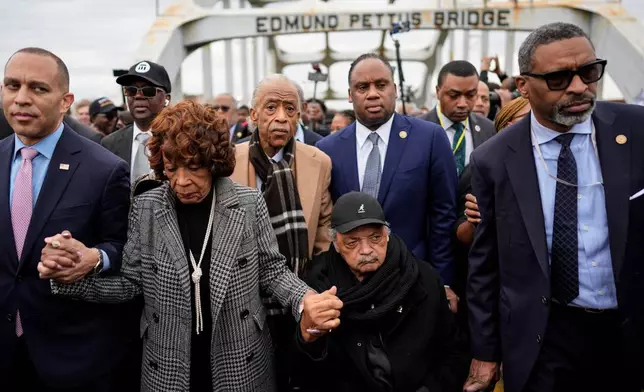 FILE - U.S. Rep. Hakeem Jeffries, D-NY, U.S. Rep. Maxine Waters, D-Calif., Rev. Al Sharpton, Rev. Jesse Jackson and NAACP President Derrick Johnson march across the Edmund Pettus bridge during the 60th anniversary of the march to ensure that African Americans could exercise their constitutional right to vote, March 9, 2025, in Selma, Ala. (AP Photo/Mike Stewart, File)