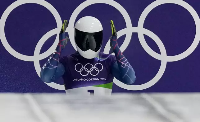 Britain's Matt Weston prepares to start for a men's skeleton run at the 2026 Winter Olympics, in Cortina d'Ampezzo, Italy, Thursday, Feb. 12, 2026. (AP Photo/Aijaz Rahi)