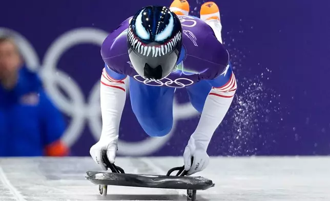 United State's Austin Florian starts for a men's skeleton run at the 2026 Winter Olympics, in Cortina d'Ampezzo, Italy, Thursday, Feb. 12, 2026. (AP Photo/Aijaz Rahi)