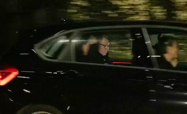 In this photo taken from video by Sky News, Britain's former ambassador to the U.S. Peter Mandelson is seen in a vehicle leaving a police station in London in the early hours of Tuesday, Feb. 24, 2026. (Sky News Exclusive via AP)