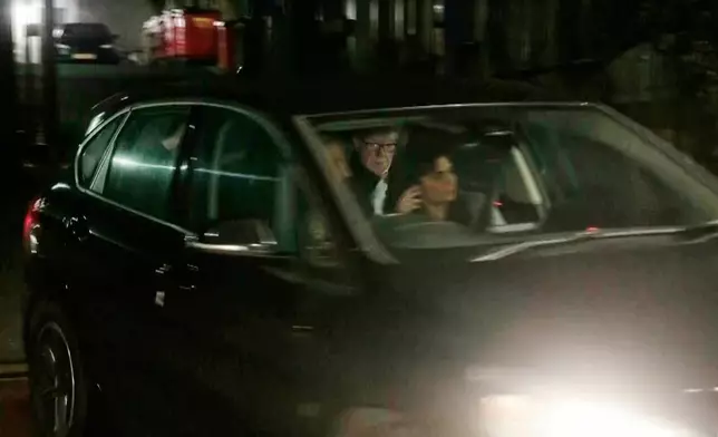 In this photo taken from video by Sky News, Britain's former ambassador to the U.S. Peter Mandelson is seen in a vehicle leaving a police station in London in the early hours of Tuesday, Feb. 24, 2026. (Sky News Exclusive via AP)