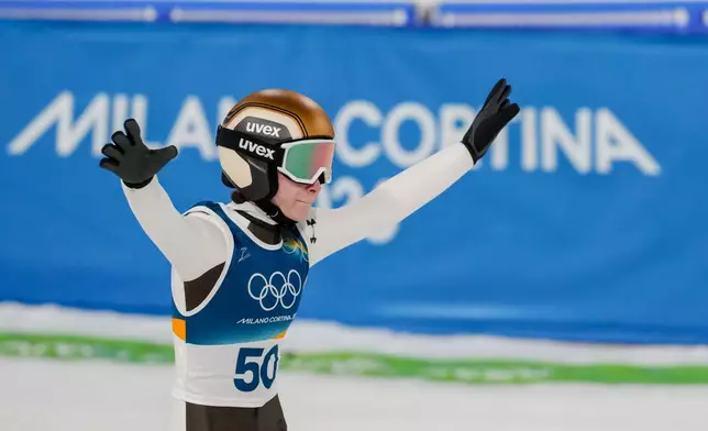 Nika Prevc, of Slovenia, reacts after her final round jump of the ski jumping women's normal hill individual, at the 2026 Winter Olympics, in Predazzo, Italy, Saturday, Feb. 7, 2026. (AP Photo/Evgeniy Maloletka)