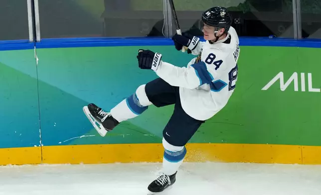 Finland's Kaapo Kakko celebrates after scoring a goal against Slovakia during the third period of the men's ice hockey bronze medal game at the 2026 Winter Olympics in Milan, Italy, Saturday, Feb. 21, 2026. (AP Photo/Carolyn Kaster)