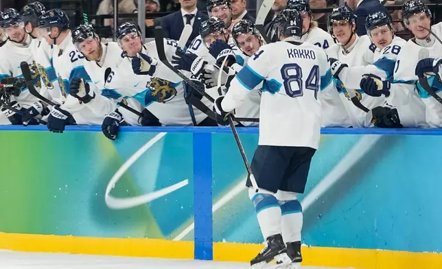 Finland's Kaapo Kakko (84) celebrates after scoring his side's fourth goal during a men's ice hockey bronze medal game between Slovakia and Finland at the 2026 Winter Olympics, in Milan, Italy, Saturday, Feb. 21, 2026. (AP Photo/Hassan Ammar)