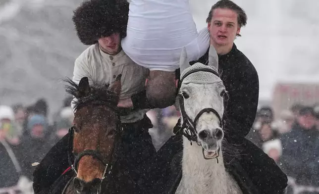 FILE - Riders show off their skills during Maslenitsa, or Shrovetide holiday celebrations in St. Petersburg, Russia, Feb. 22, 2026. (AP Photo/Dmitri Lovetsky, File)