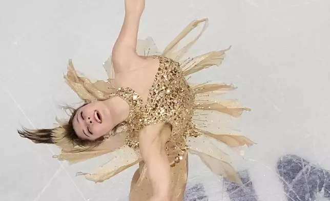 FILE - Alysa Liu of the U.S. competes during the women's figure skating free program at the 2026 Winter Olympics, in Milan, Italy, Thursday, Feb. 19, 2026. (AP Photo/Christophe Ena, File)