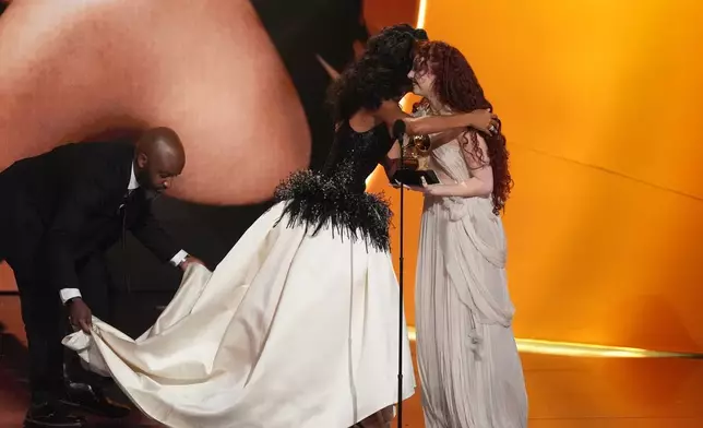Chappell Roan, right, presents the award for best new artist to Olivia Dean, left, during the 68th annual Grammy Awards on Sunday, Feb. 1, 2026, in Los Angeles. (AP Photo/Chris Pizzello)