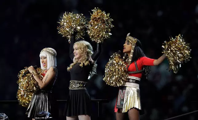 FILE - Madonna, center, performs with Nicki Minaj, left, and M.I.A. during halftime of the NFL Super Bowl XLVI football game in Indianapolis on Feb. 5, 2012. (AP Photo/Michael Conroy, File)